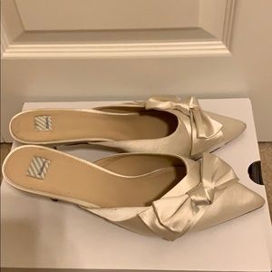 Hitherto white satin bow slip on heels